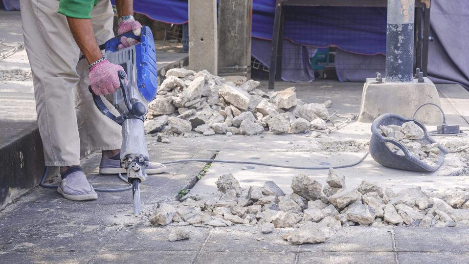 Demolition contractor demolishing a building