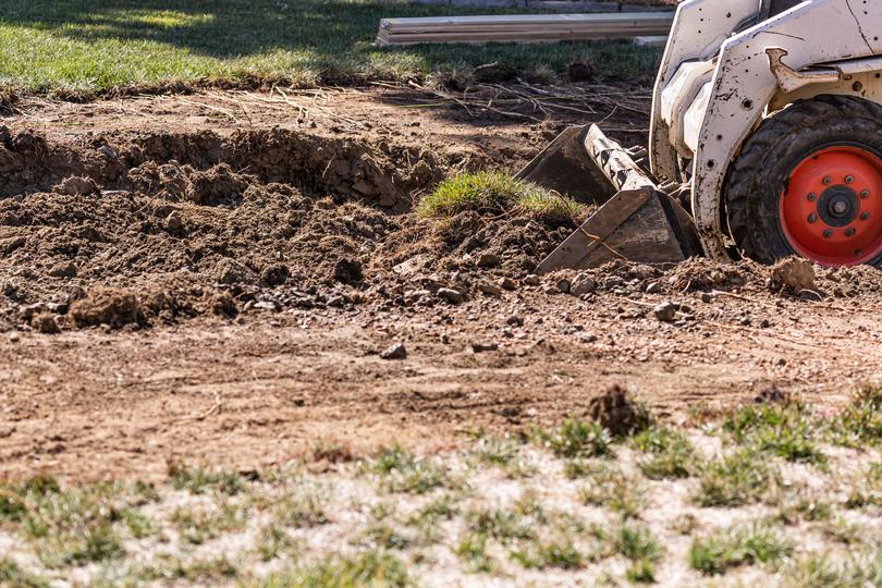 Pool being removed from a backyard